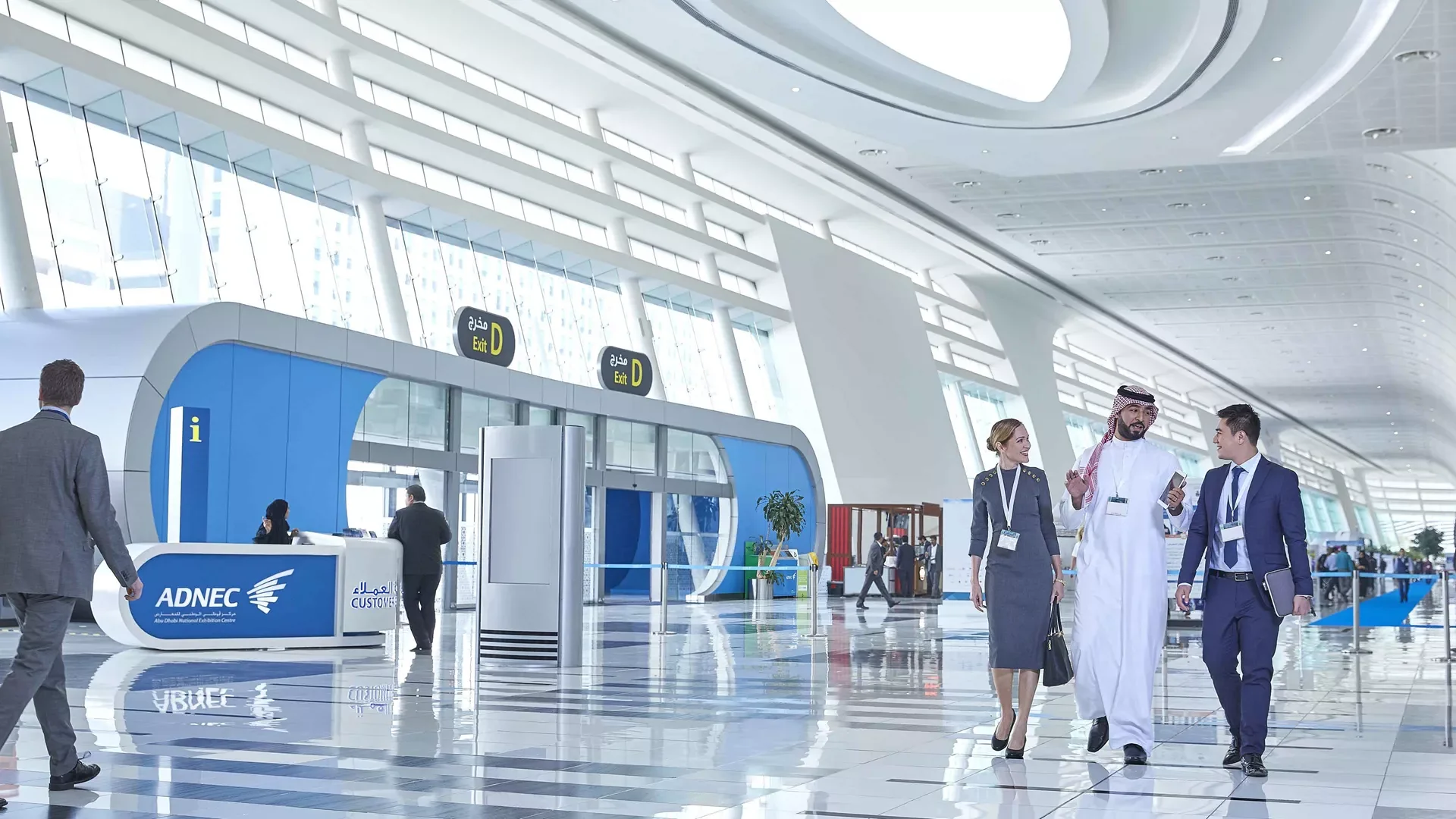 Delegates walking through the ADNEC concourse