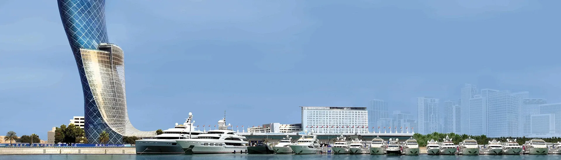 ADNEC marina with yachts and the Capital Gate tower